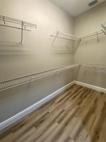 a bathroom with a sink toilet and a mirror