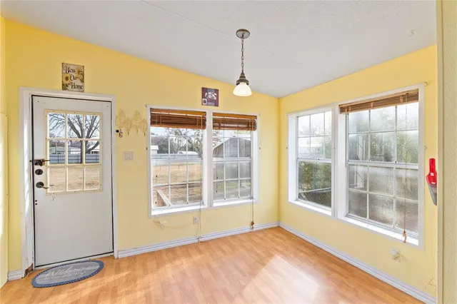 a view of an empty room with a window