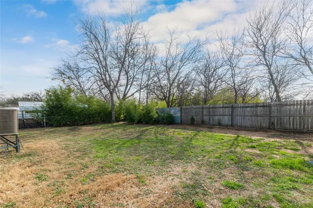 a view of a backyard with trees