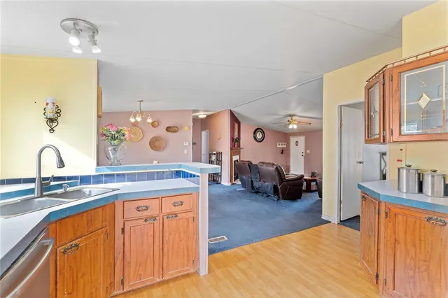 a view of living room with granite countertop furniture and fireplace