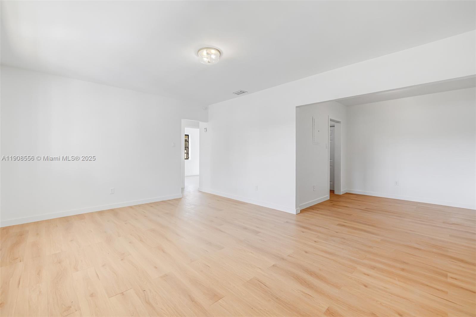 Grapeland Heights Estates Miami, FL 33125 - Photo 21 of 26 a view of an empty room with wooden floor