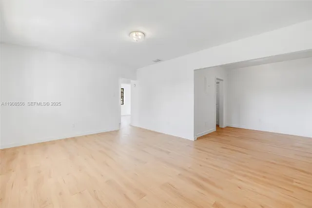 an empty room with windows