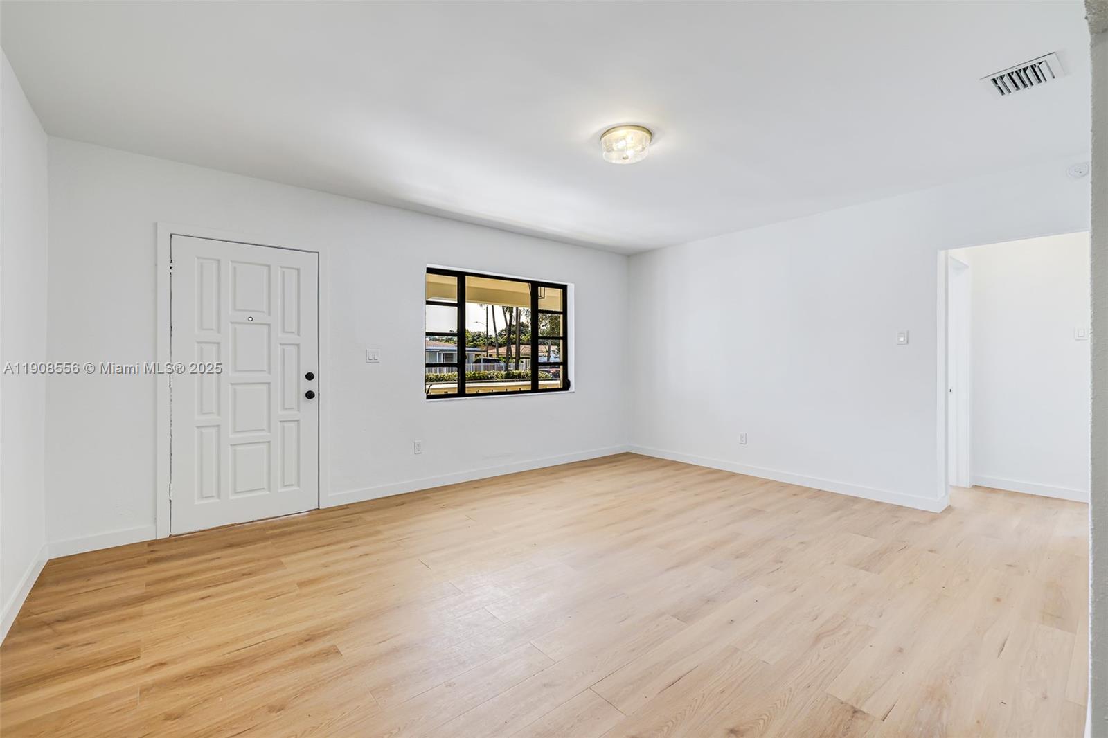 Grapeland Heights Estates Miami, FL 33125 - Photo 22 of 26 an empty room with windows