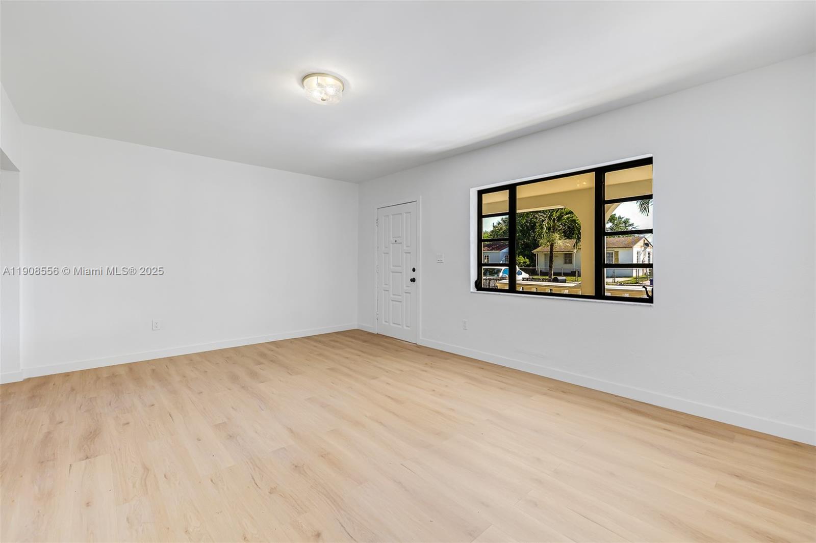 Grapeland Heights Estates Miami, FL 33125 - Photo 23 of 26 an empty room with windows