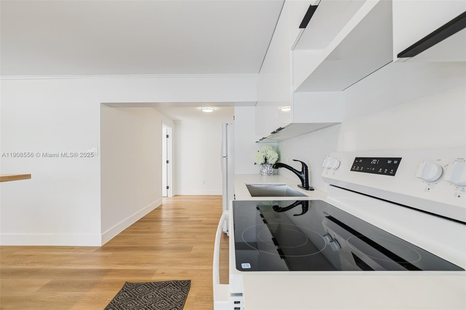 Grapeland Heights Estates Miami, FL 33125 - Photo 8 of 26 a living room with stainless steel appliances kitchen island a sink and cabinets