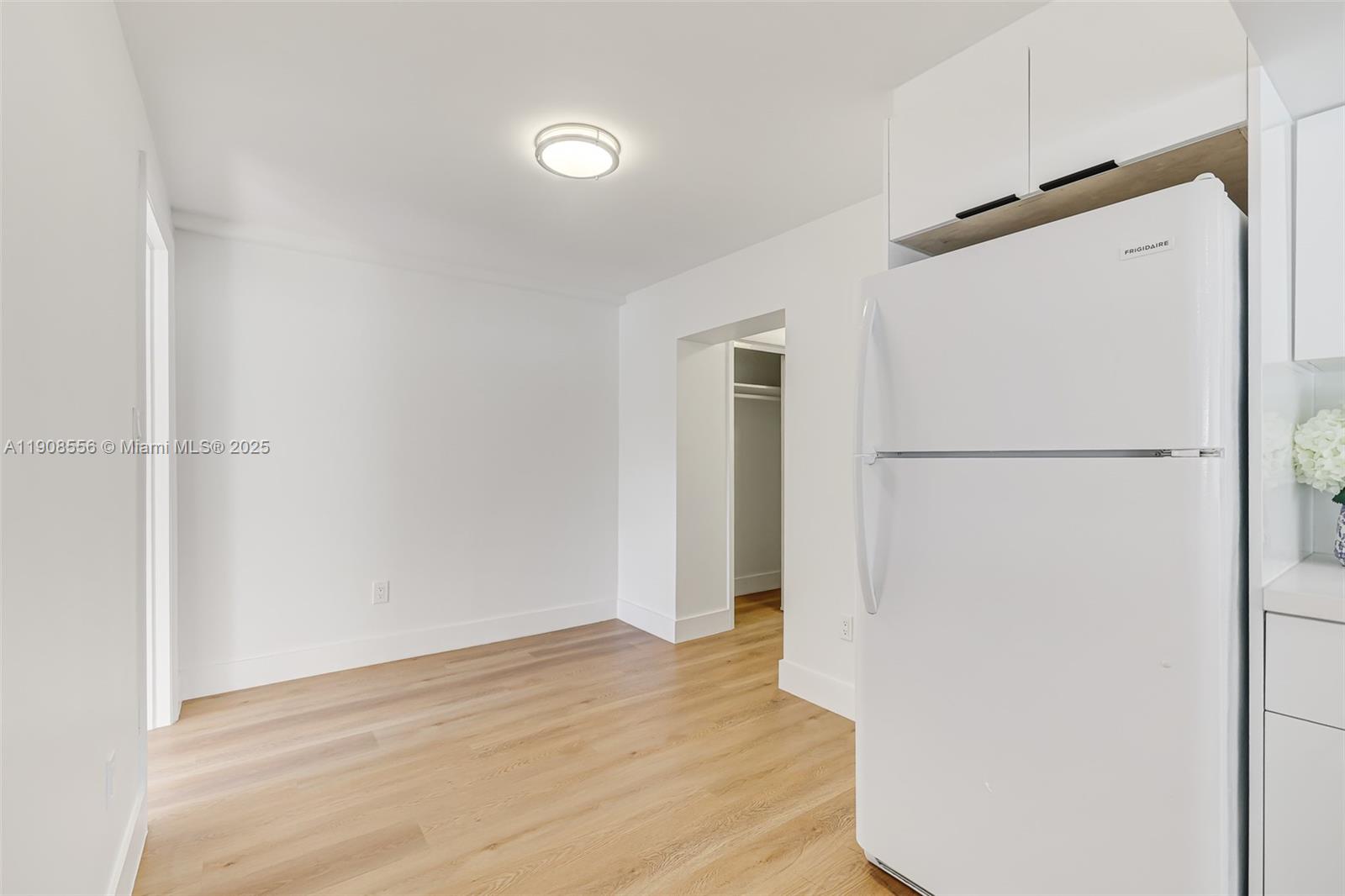 Grapeland Heights Estates Miami, FL 33125 - Photo 9 of 26 a view of walk in closet with empty racks