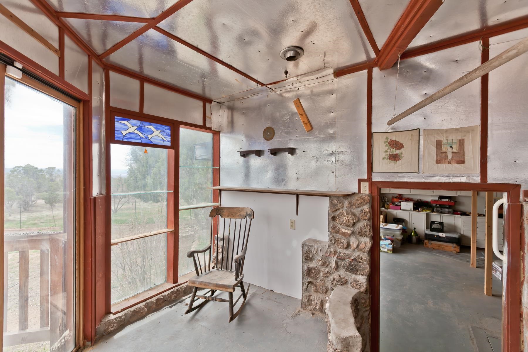 25352 Cedar Mesa Road Cedaredge, CO 81413 - Photo 18 of 42 a view of a livingroom with furniture and a window