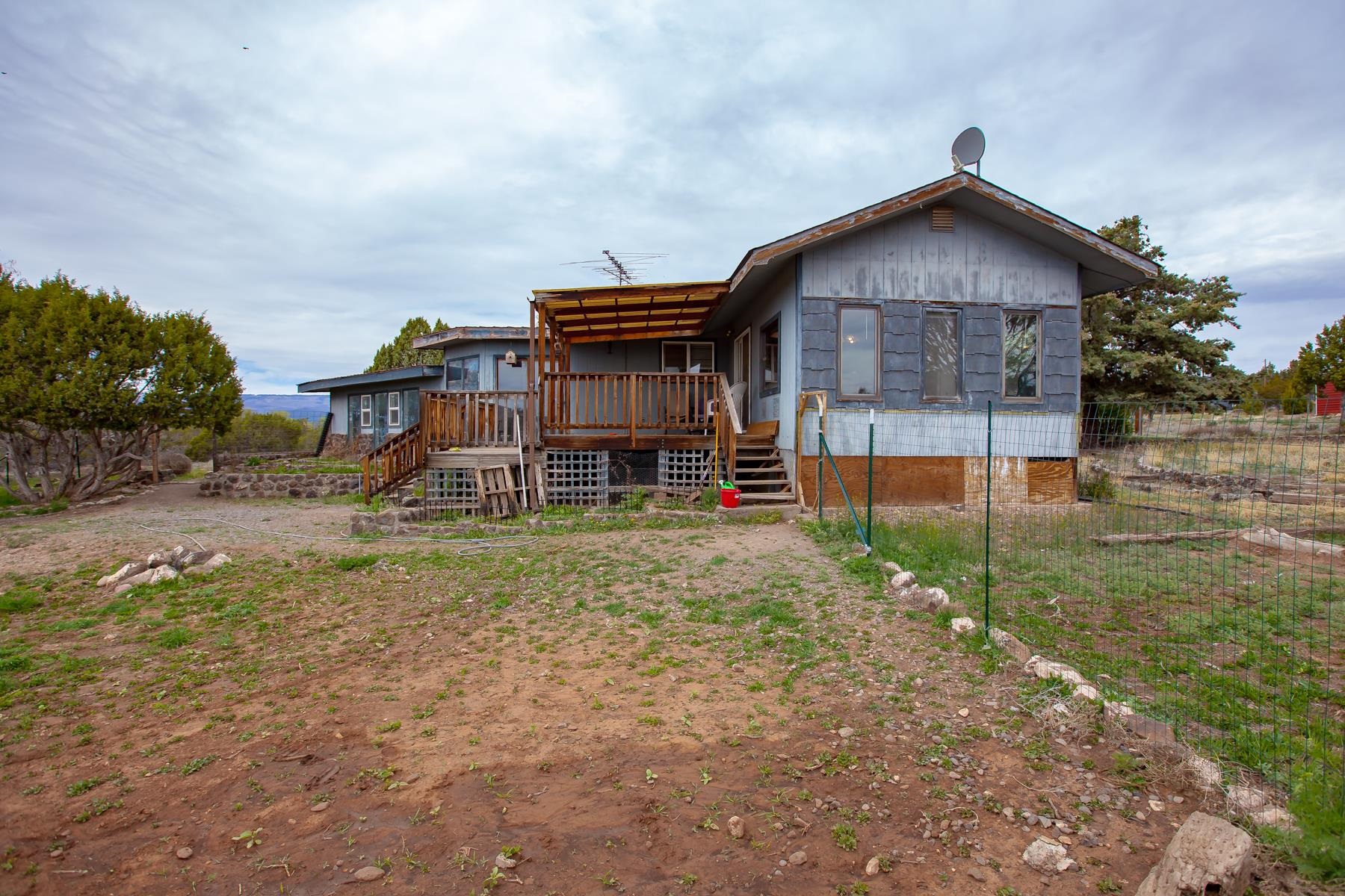 25352 Cedar Mesa Road Cedaredge, CO 81413 - Photo 24 of 42 a front view of a house with a yard