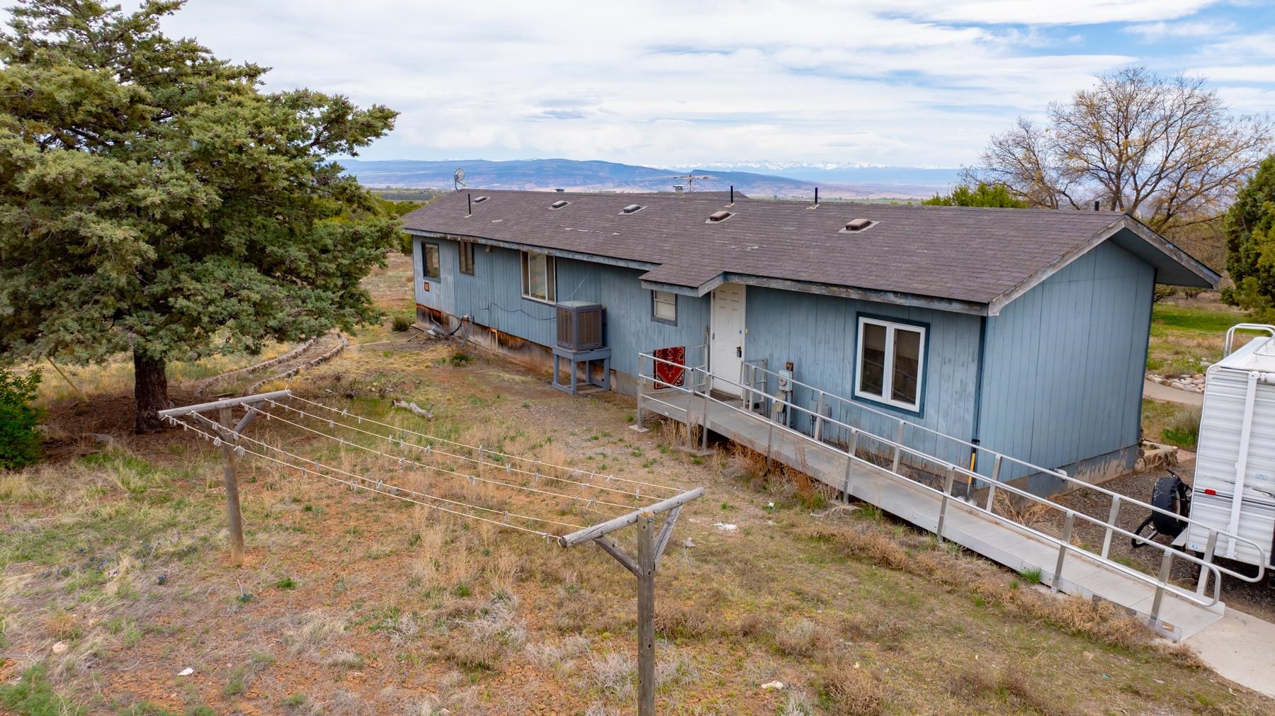 25352 Cedar Mesa Road Cedaredge, CO 81413 - Photo 27 of 42 a view of a house with a patio