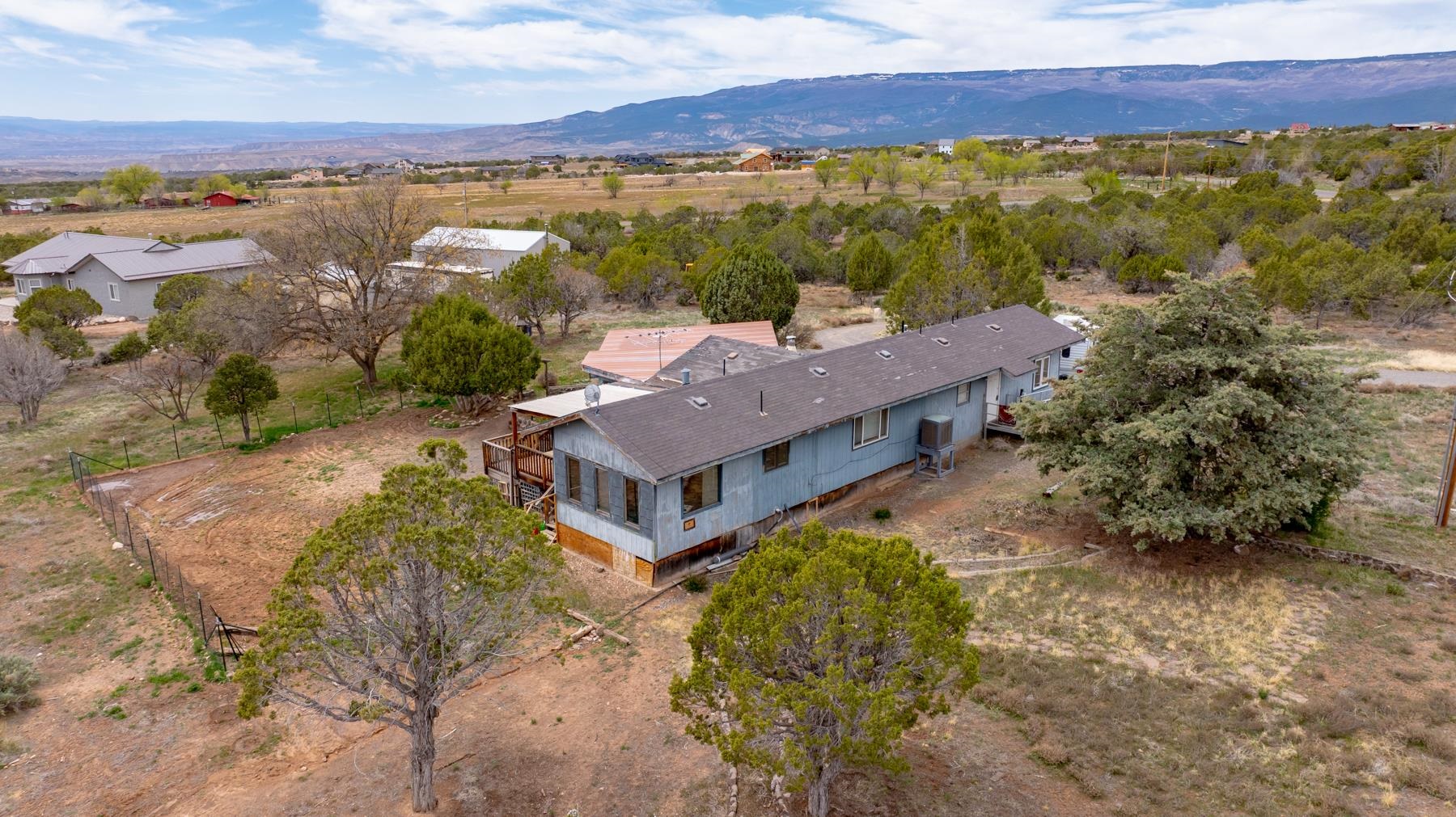 25352 Cedar Mesa Road Cedaredge, CO 81413 - Photo 35 of 42 an aerial view of a house with a lake