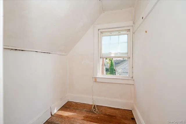 a view of a hallway with stairs