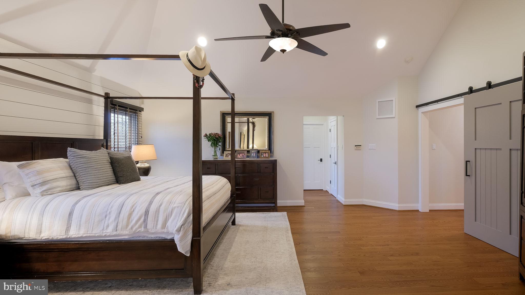 33 Bittersweet Drive Doylestown, PA 18901 - Photo 33 of 71 a bedroom with a bed ceiling fan and a wooden floor