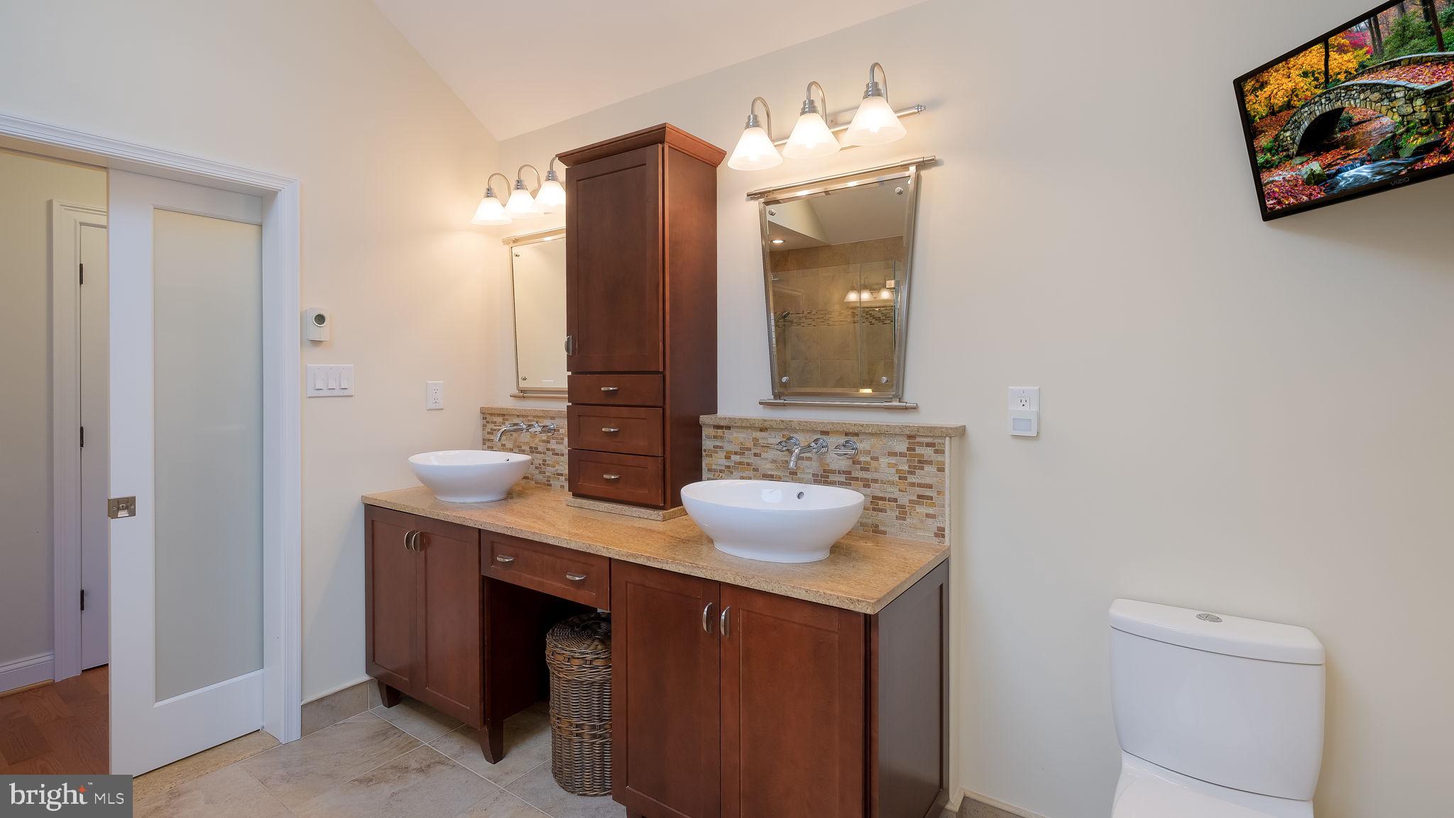 33 Bittersweet Drive Doylestown, PA 18901 - Photo 34 of 71 a bathroom with a sink and a mirror