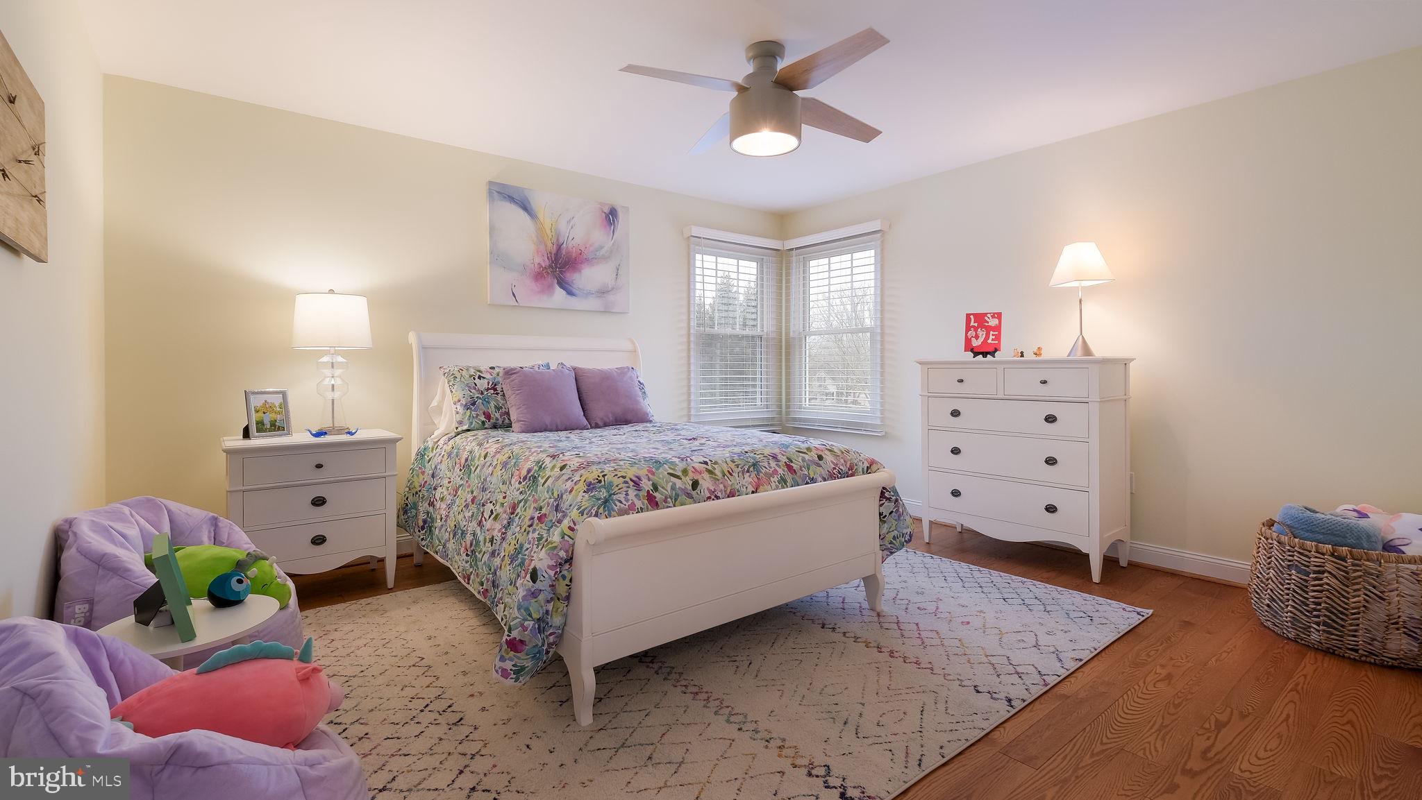 33 Bittersweet Drive Doylestown, PA 18901 - Photo 41 of 71 a bedroom with a bed and a chandelier