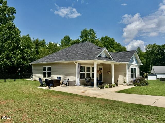 574 East Ridge Avenue Liberty, NC 27298 - Photo 2 of 28 a view of a house with a yard