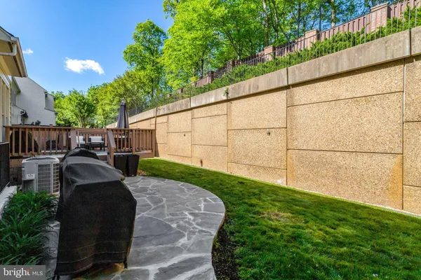 a view of a backyard with sitting area