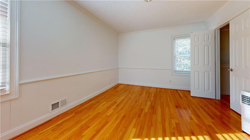 1319 Janmar Road Snellville, GA 30078 - Photo 14 of 38 a view of empty room with wooden floor and fan