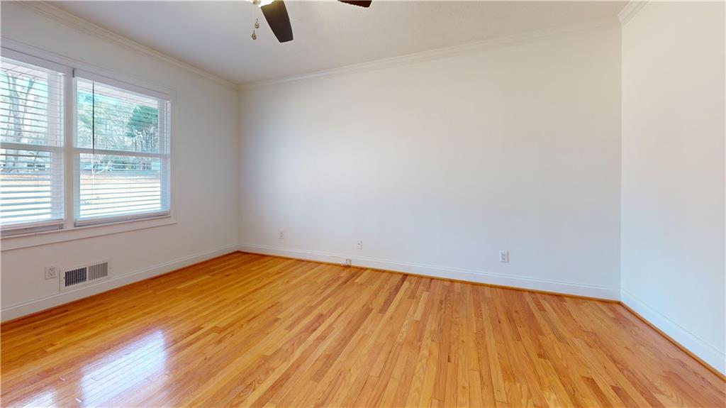 1319 Janmar Road Snellville, GA 30078 - Photo 16 of 38 wooden floor in an empty room with a window