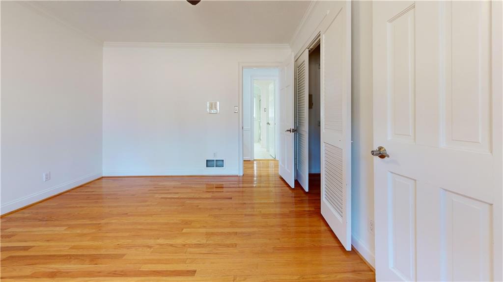 1319 Janmar Road Snellville, GA 30078 - Photo 17 of 38 a view of a hallway with wooden floor