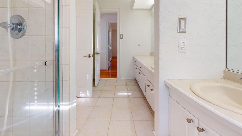1319 Janmar Road Snellville, GA 30078 - Photo 19 of 38 a bathroom with a sink and a tub