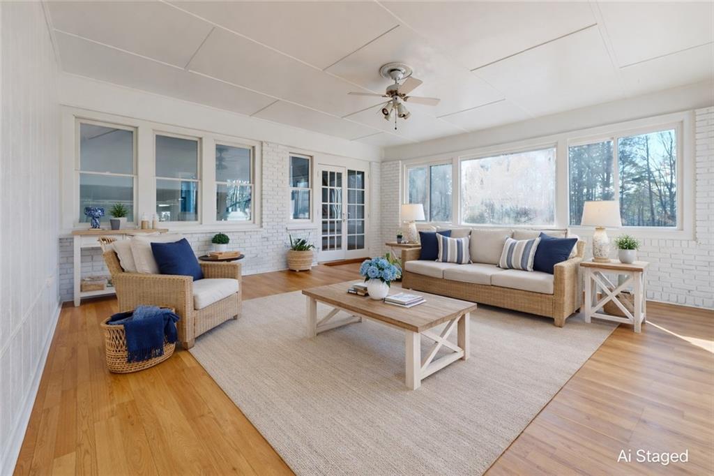 1319 Janmar Road Snellville, GA 30078 - Photo 22 of 38 a living room with furniture and a large window