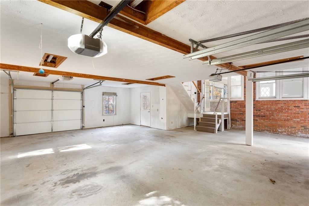 1319 Janmar Road Snellville, GA 30078 - Photo 27 of 38 a view of a house with a garage