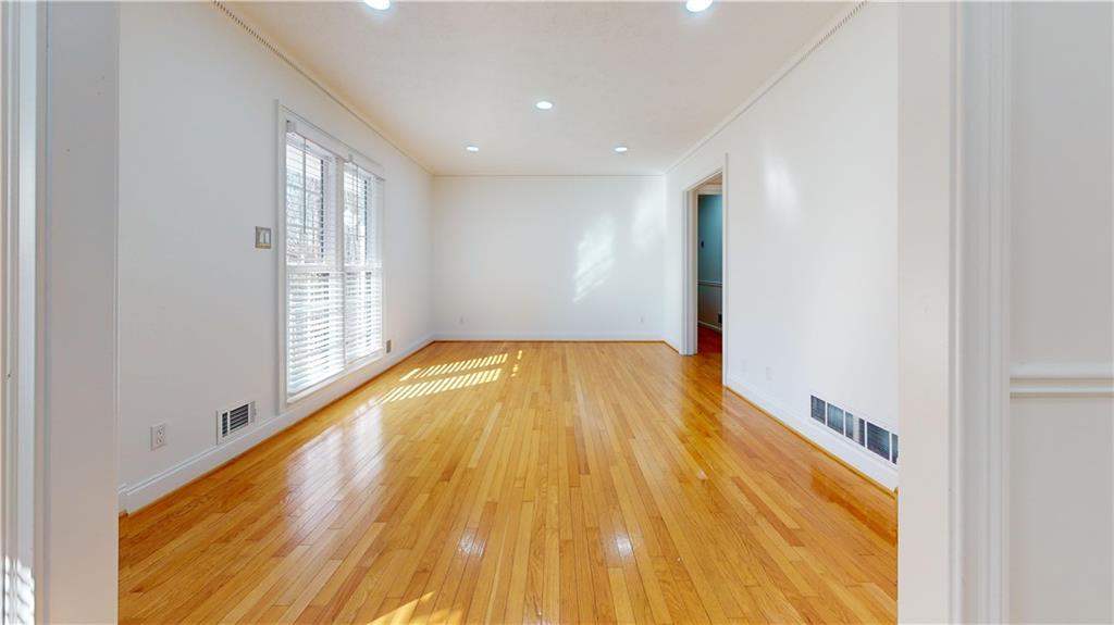 1319 Janmar Road Snellville, GA 30078 - Photo 31 of 38 a view of empty room with wooden floor and fan