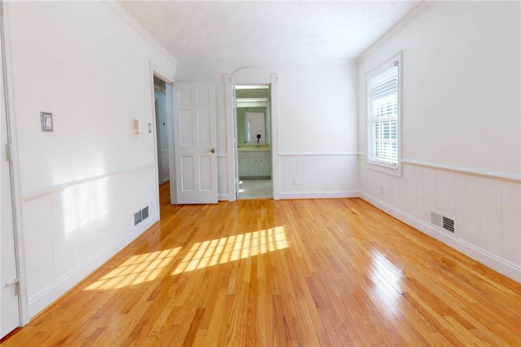 1319 Janmar Road Snellville, GA 30078 - Photo 34 of 38 a view of a room with wooden floor and large windows