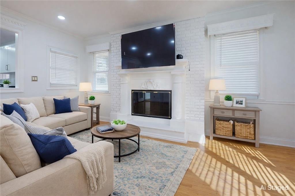 1319 Janmar Road Snellville, GA 30078 - Photo 7 of 38 a living room with furniture a flat screen tv and a fireplace