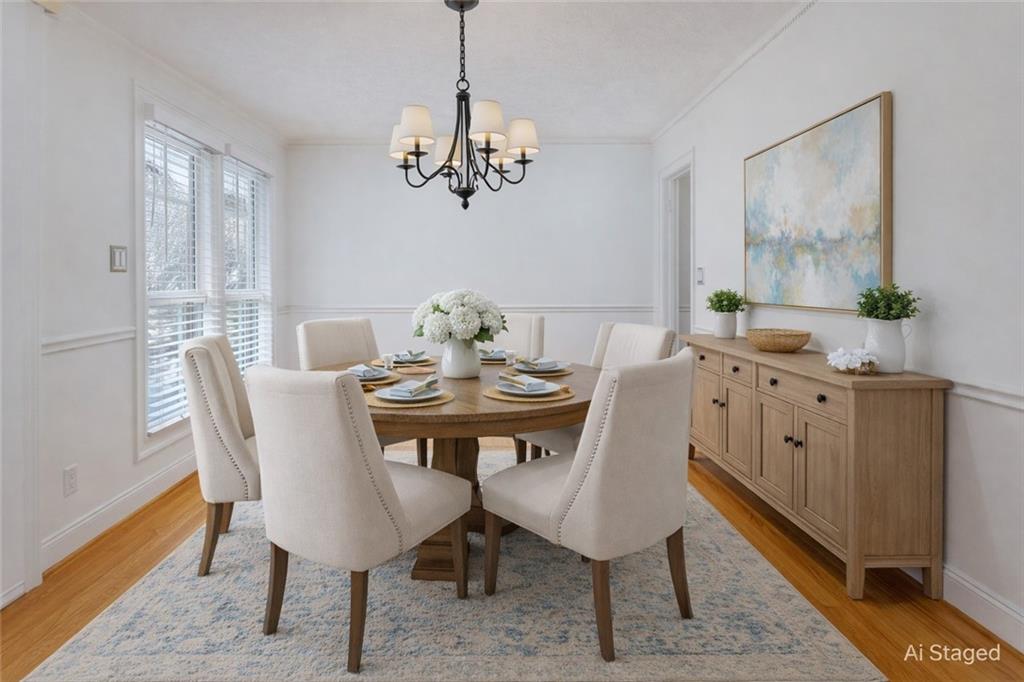 1319 Janmar Road Snellville, GA 30078 - Photo 9 of 38 a view of a dining room with furniture wooden floor and a chandelier