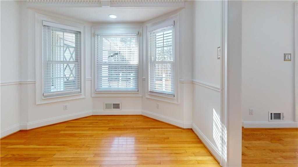 1319 Janmar Road Snellville, GA 30078 - Photo 10 of 38 a view of empty room with wooden floor and fan