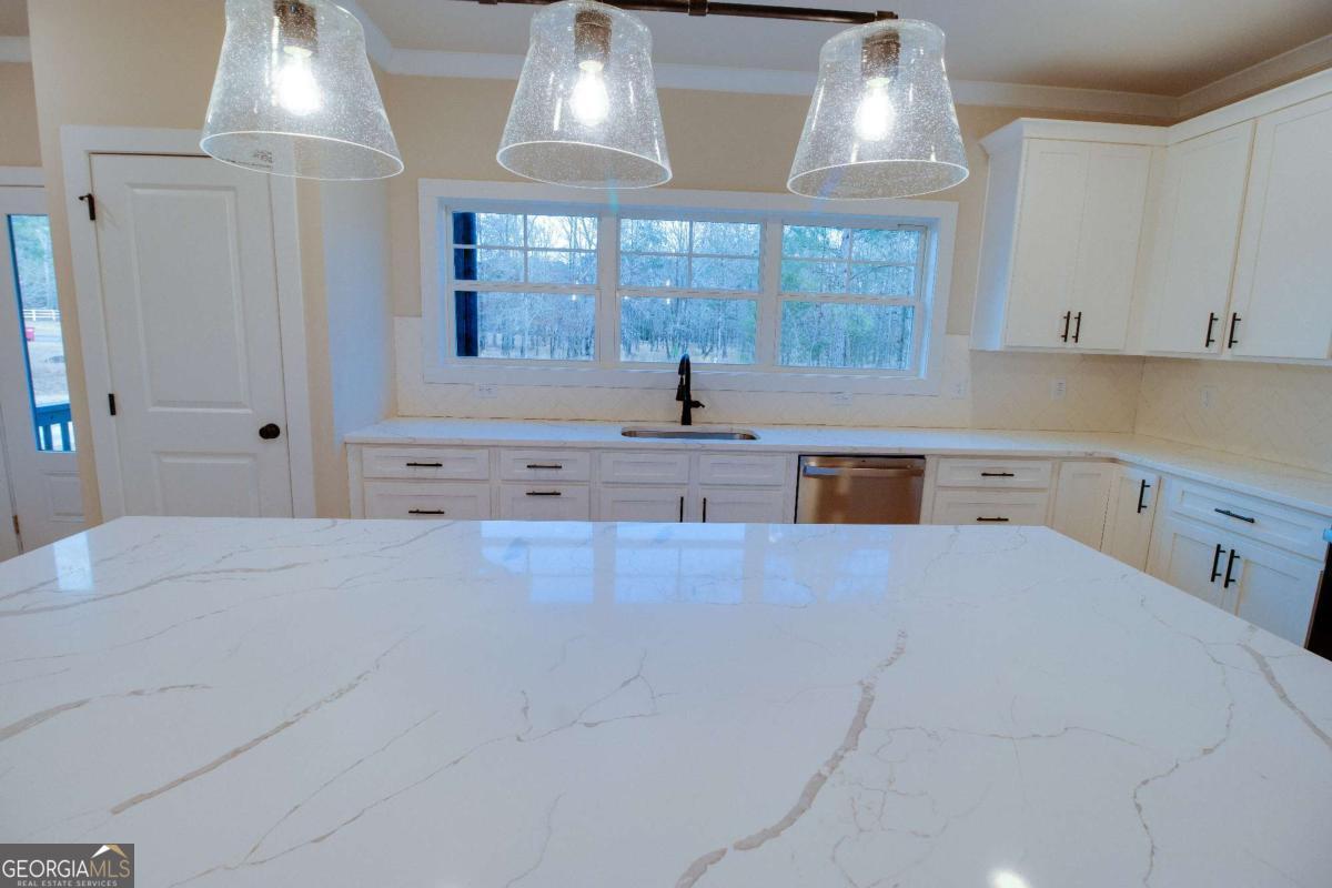 1021 Pointe Street South Tignall, GA 30668 - Photo 11 of 48 a large white kitchen with a large window