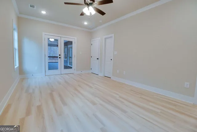 a view of an empty room with a window