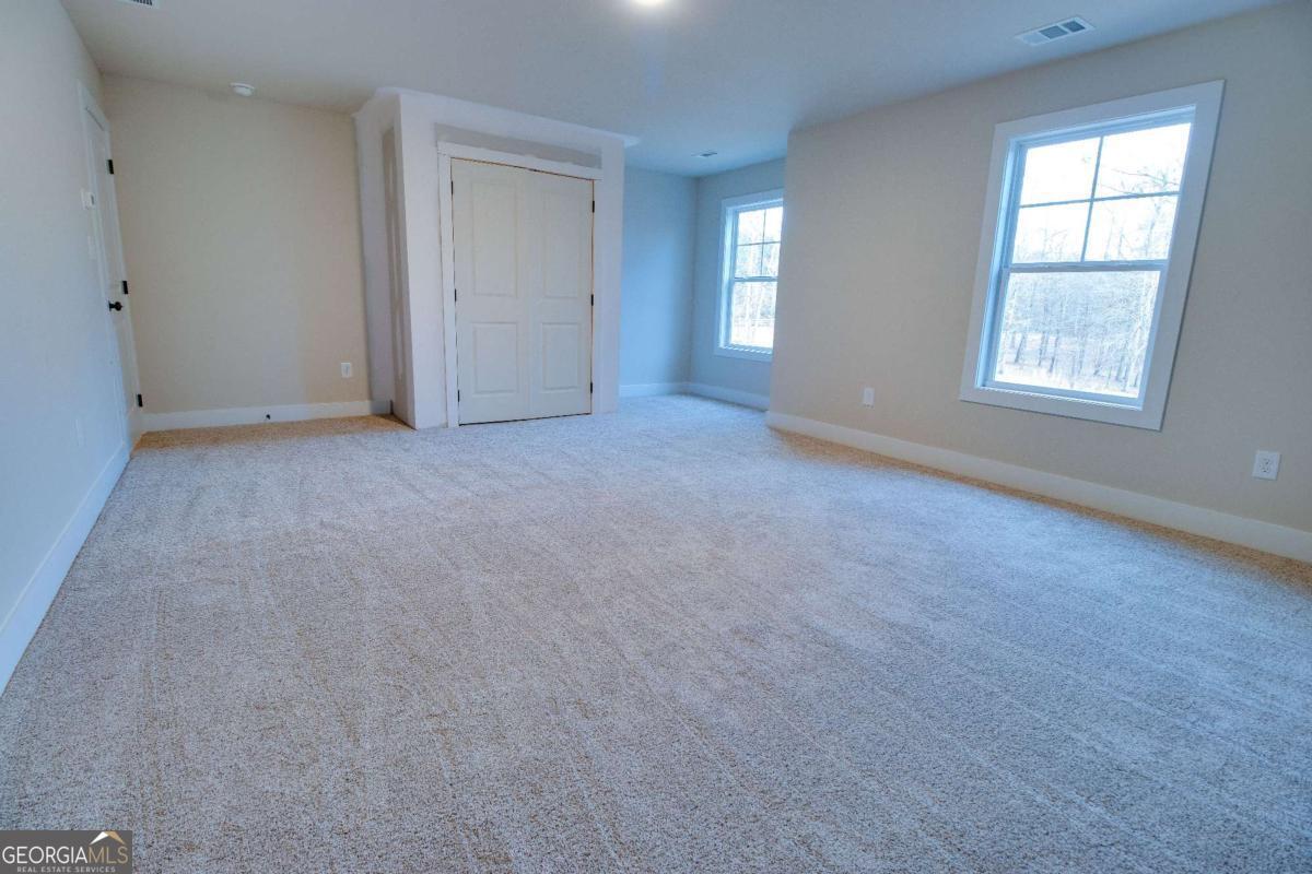 1021 Pointe Street South Tignall, GA 30668 - Photo 31 of 48 an empty room with windows