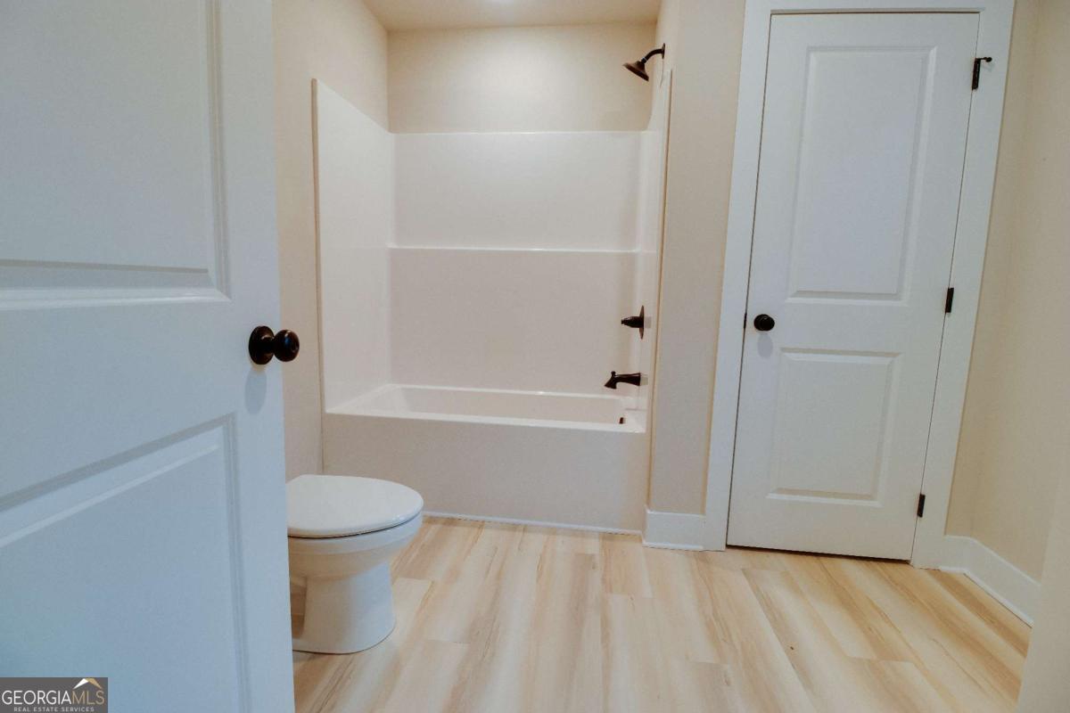 1021 Pointe Street South Tignall, GA 30668 - Photo 32 of 48 a bathroom with a shower