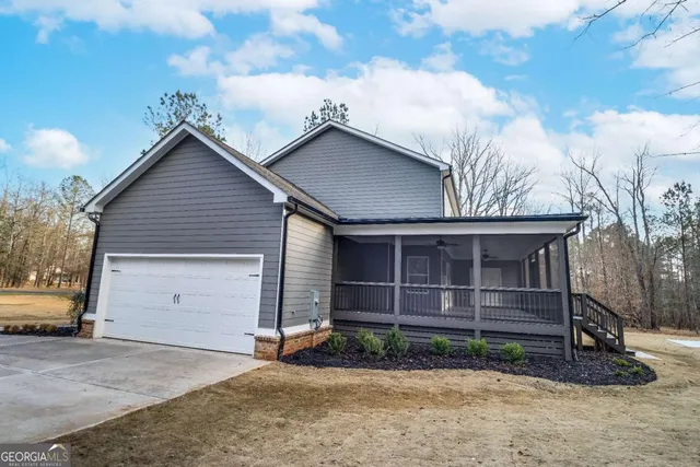 a view of a backyard of the house