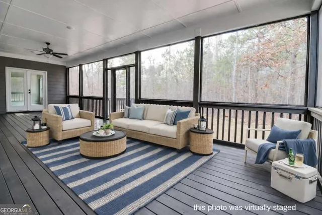 an aerial view of a house with a garden and lake view