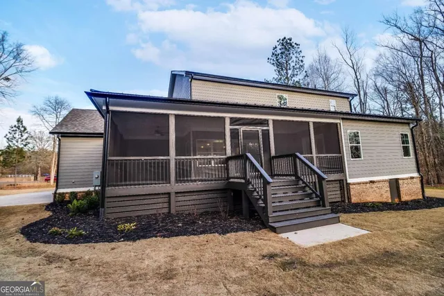 a view of a lake with a yard