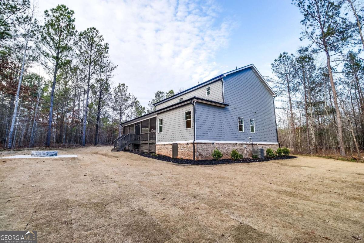 1021 Pointe Street South Tignall, GA 30668 - Photo 41 of 48 a view of a backyard of the house