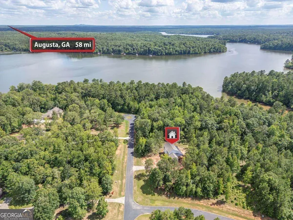 a view of a lake with a yard