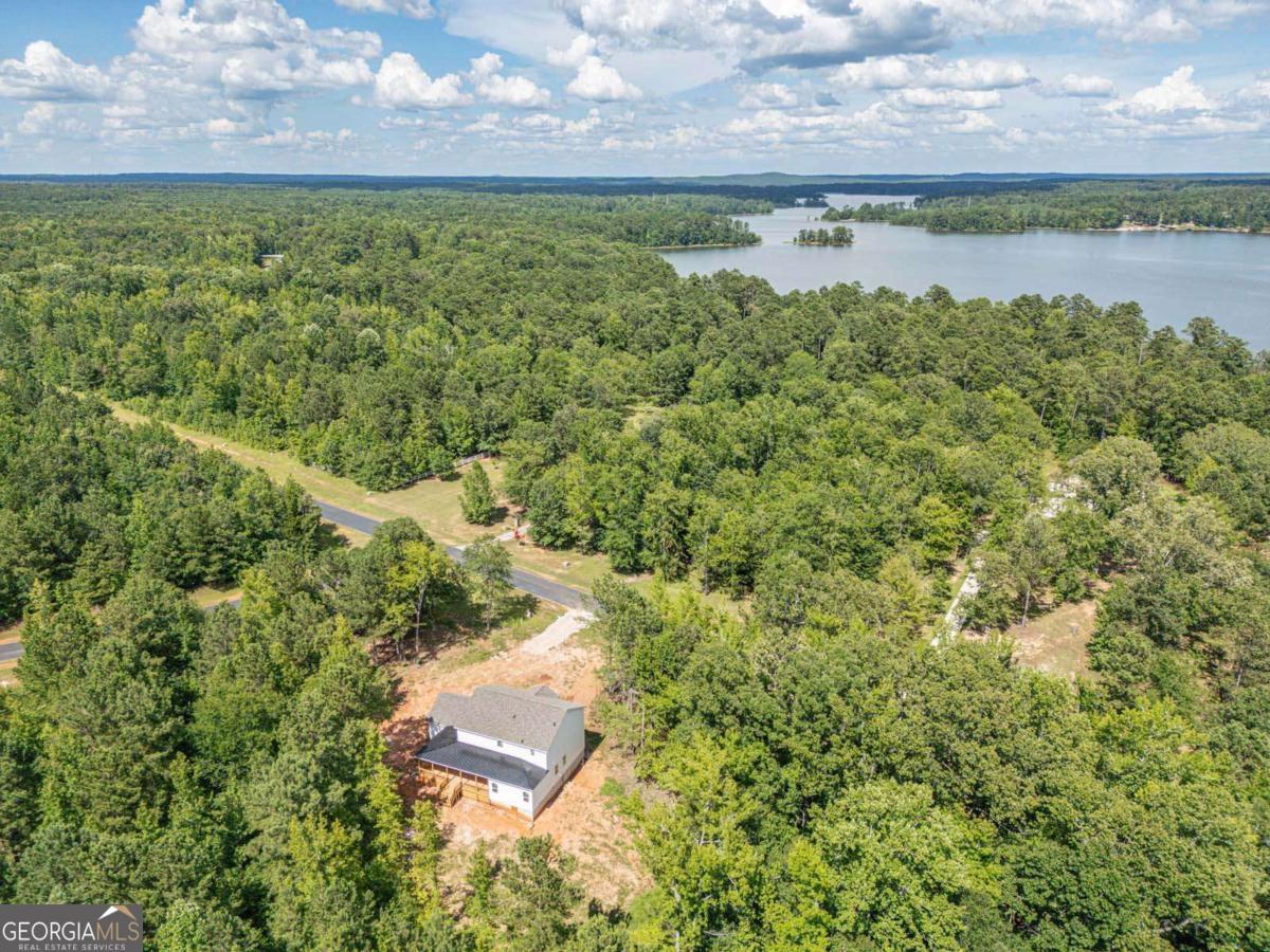 1021 Pointe Street South Tignall, GA 30668 - Photo 48 of 48 a view of a lake with an outdoor space
