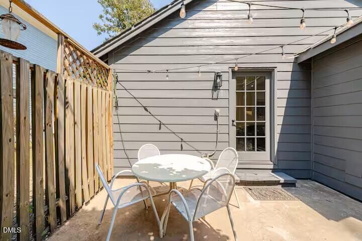 133 Prospect Avenue Raleigh, NC 27603 - Photo 7 of 7 a backyard of a house with table and chairs