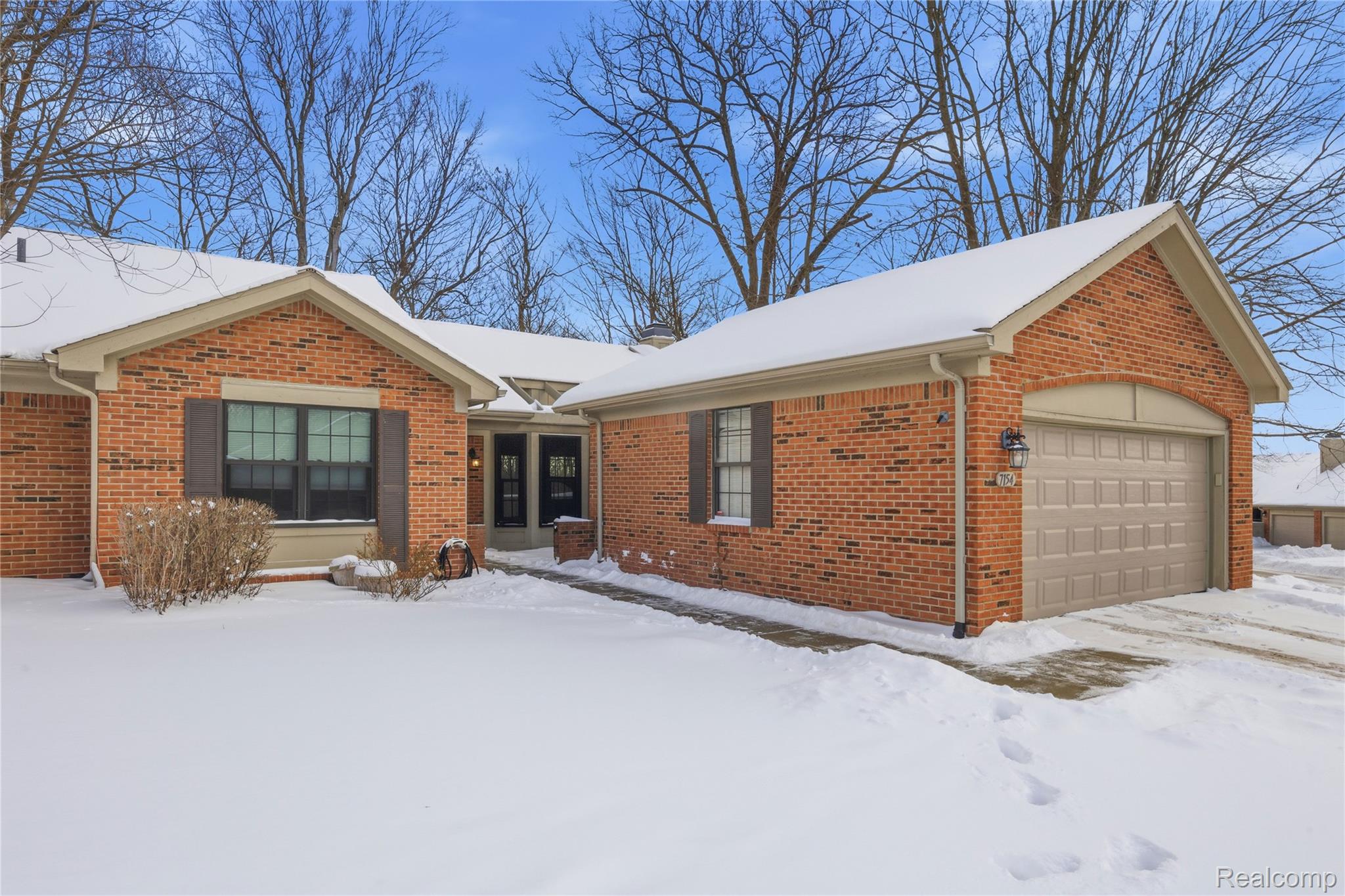 7154 Westchester Road West Bloomfield, MI 48322 - Photo 32 of 38 Single story home featuring a garage, brick siding, and a chimney