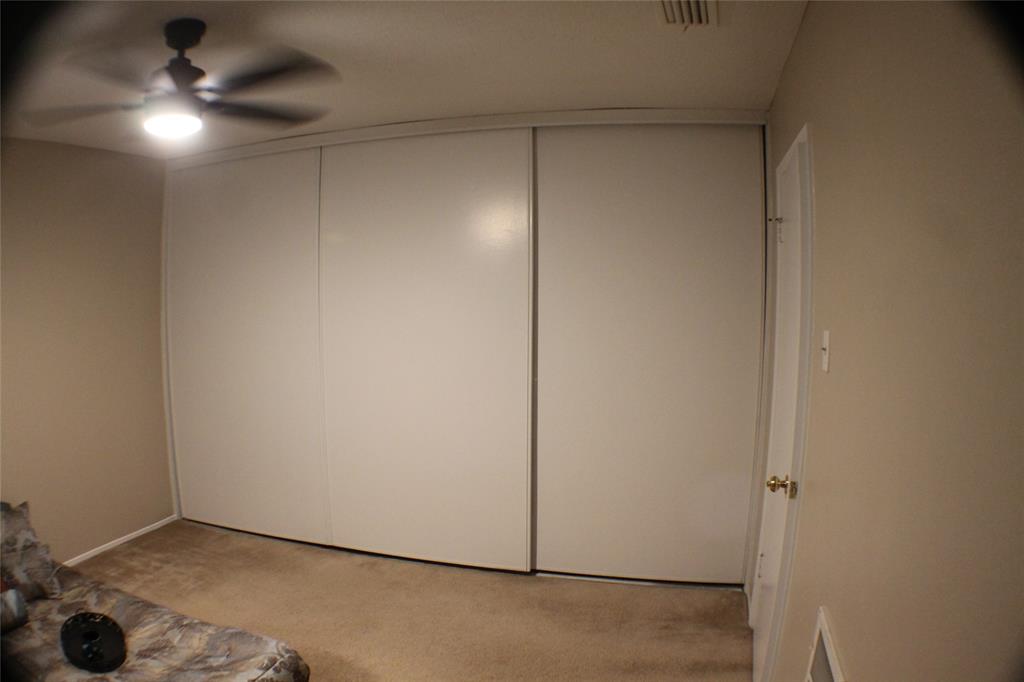 722 Intrepid Drive Garland, TX 75043 - Photo 12 of 19 an empty room with a workbench