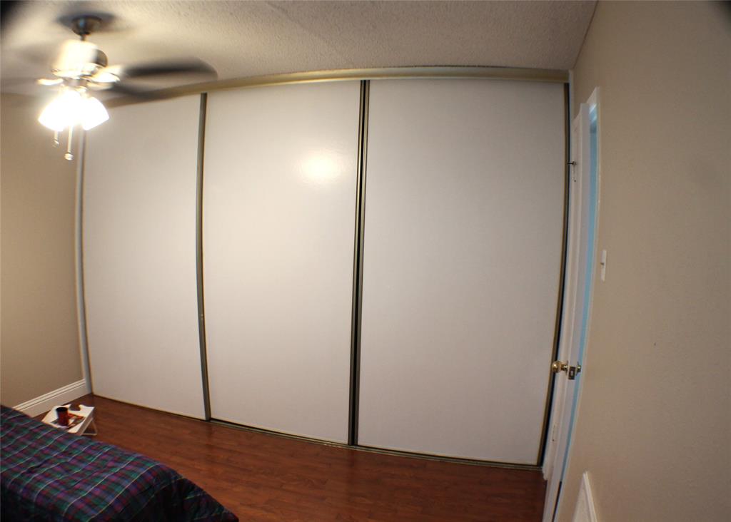 722 Intrepid Drive Garland, TX 75043 - Photo 19 of 19 a view of a room with wooden floor and a ceiling fan