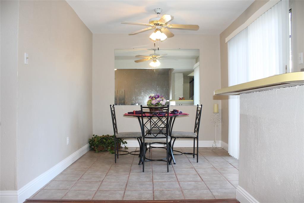 722 Intrepid Drive Garland, TX 75043 - Photo 8 of 19 a dining room with furniture and a chandelier fan