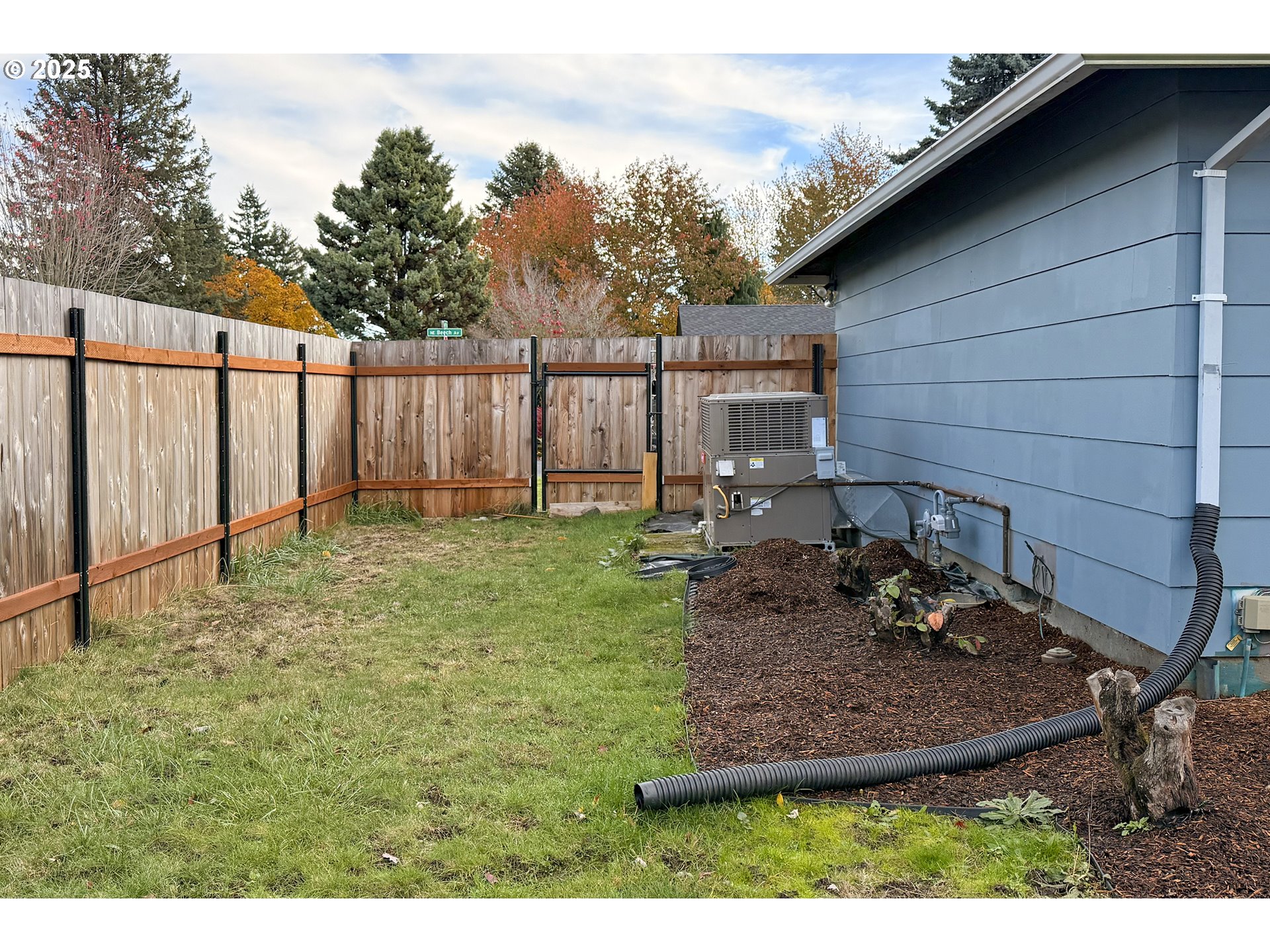 1889 Northeast Beech Avenue Gresham, OR 97030 - Photo 16 of 27 a view of a backyard with plants and trees