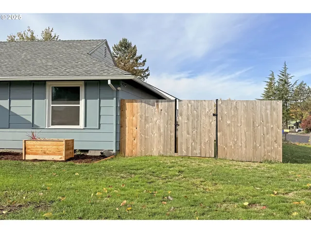 a view of a swimming pool with a yard