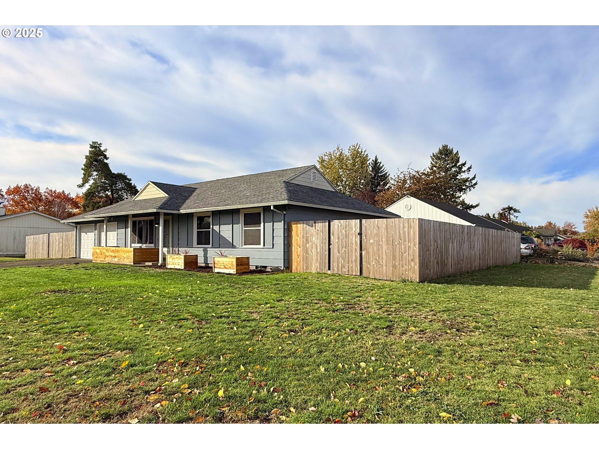 1889 Northeast Beech Avenue Gresham, OR 97030 - Photo 22 of 27 a house with green field in front of it
