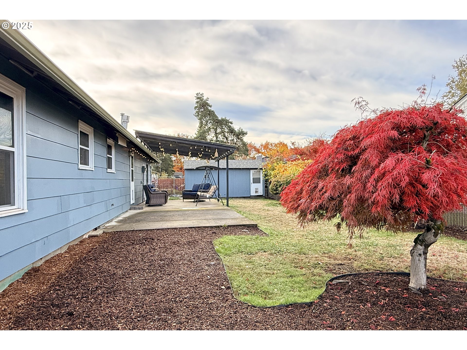 1889 Northeast Beech Avenue Gresham, OR 97030 - Photo 26 of 27 a view of a house with backyard and a tree